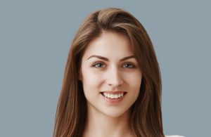 Young woman with a heart-shaped face featuring a broad forehead, defined cheekbones, and a narrower chin.